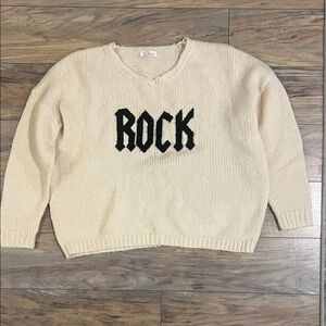 Kiss Cream Sweater with Black Rock Motif